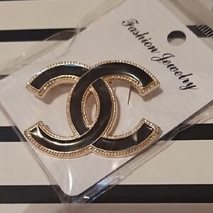 Elegant Black and Gold Brooch